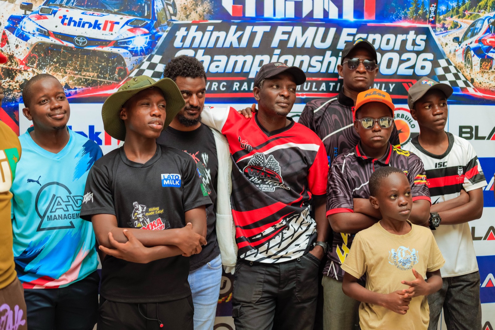 Round 1 competitors in front of the championship banner