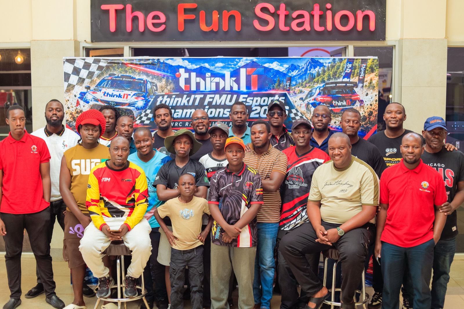 Round 1 group photo under The Fun Station sign
